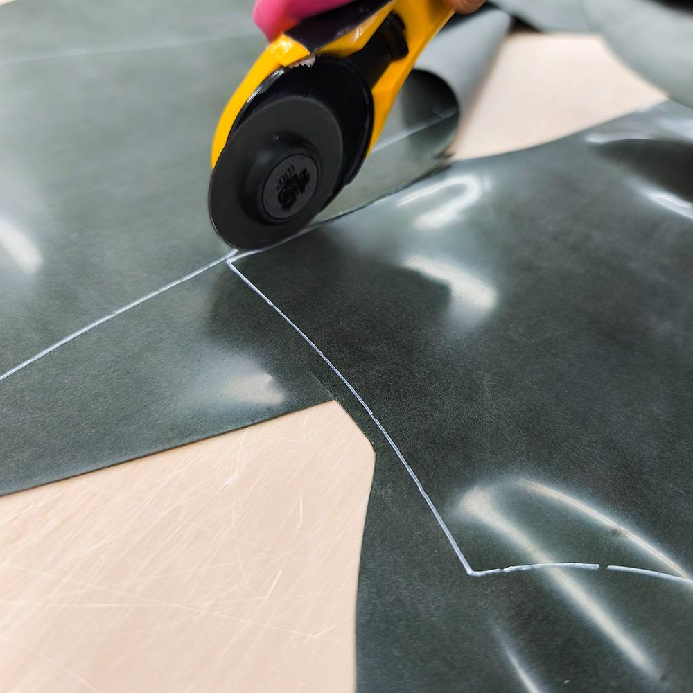 A Libidex garment being cut by hand